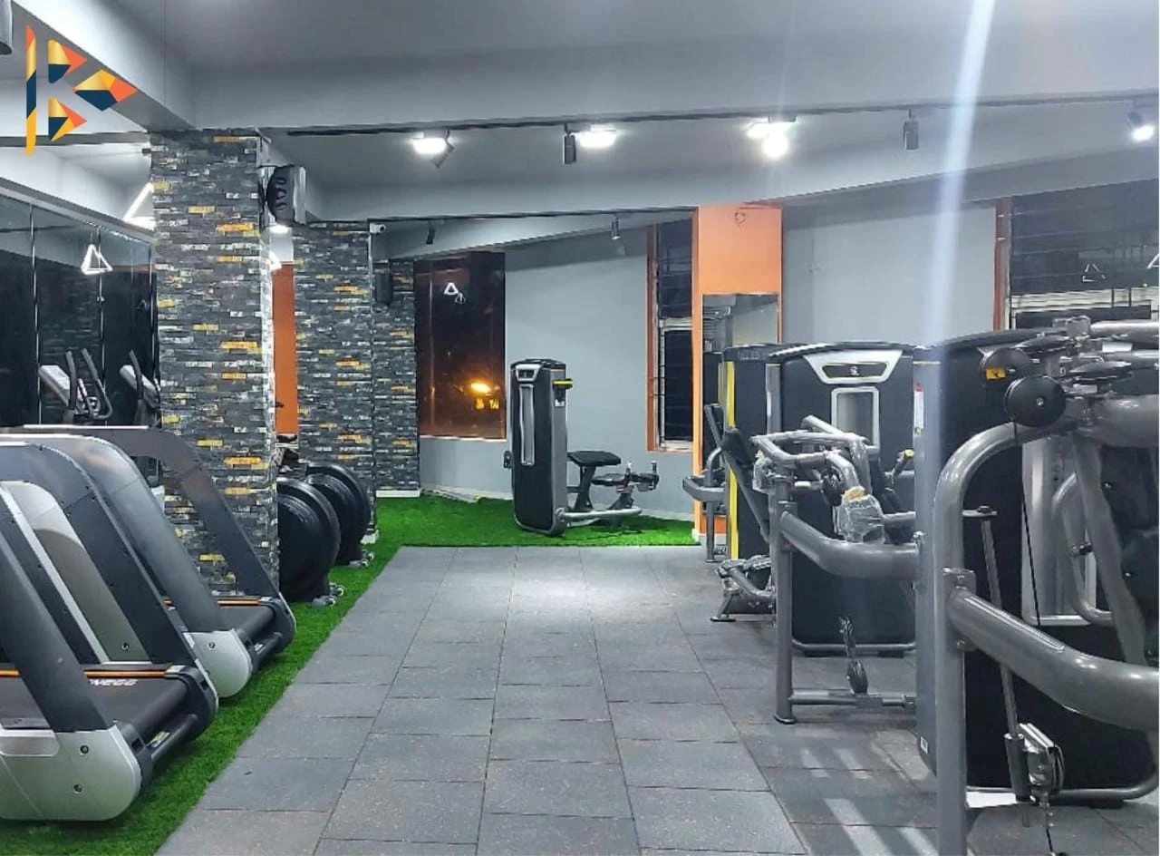 Kalya Fitness World gym floor — treadmills, machines, and training zones